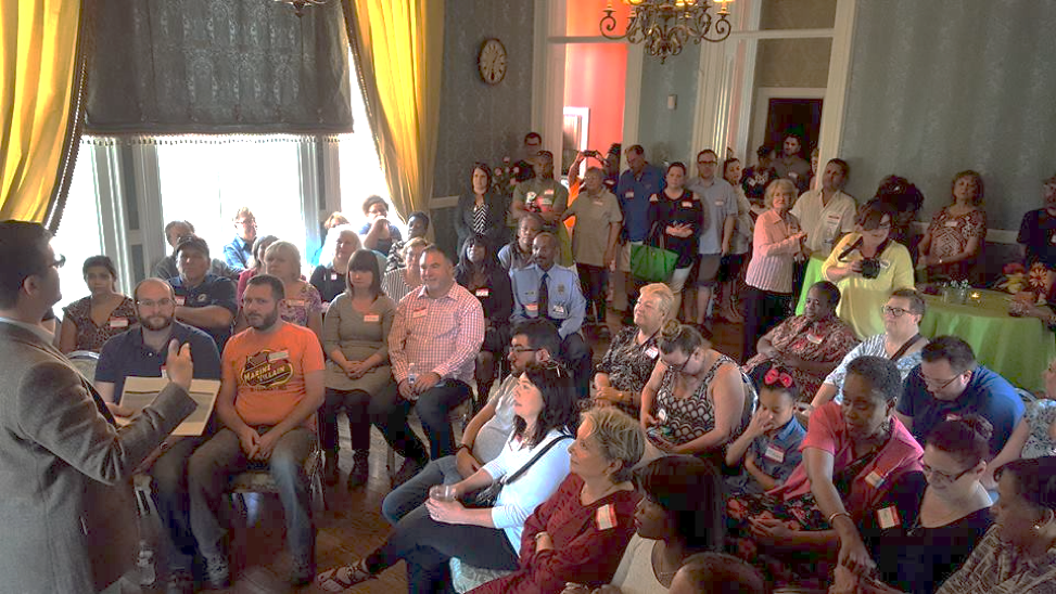 Michal Powers speaks to St. Louis residents.