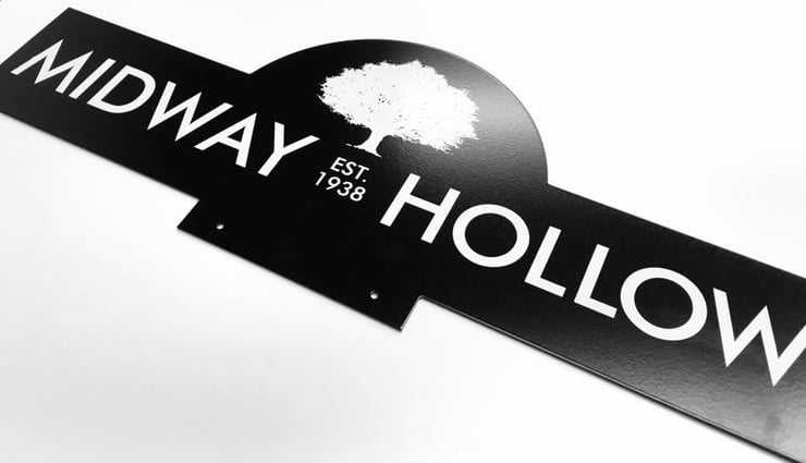 The street sign topper designed by Adam and neighbors.