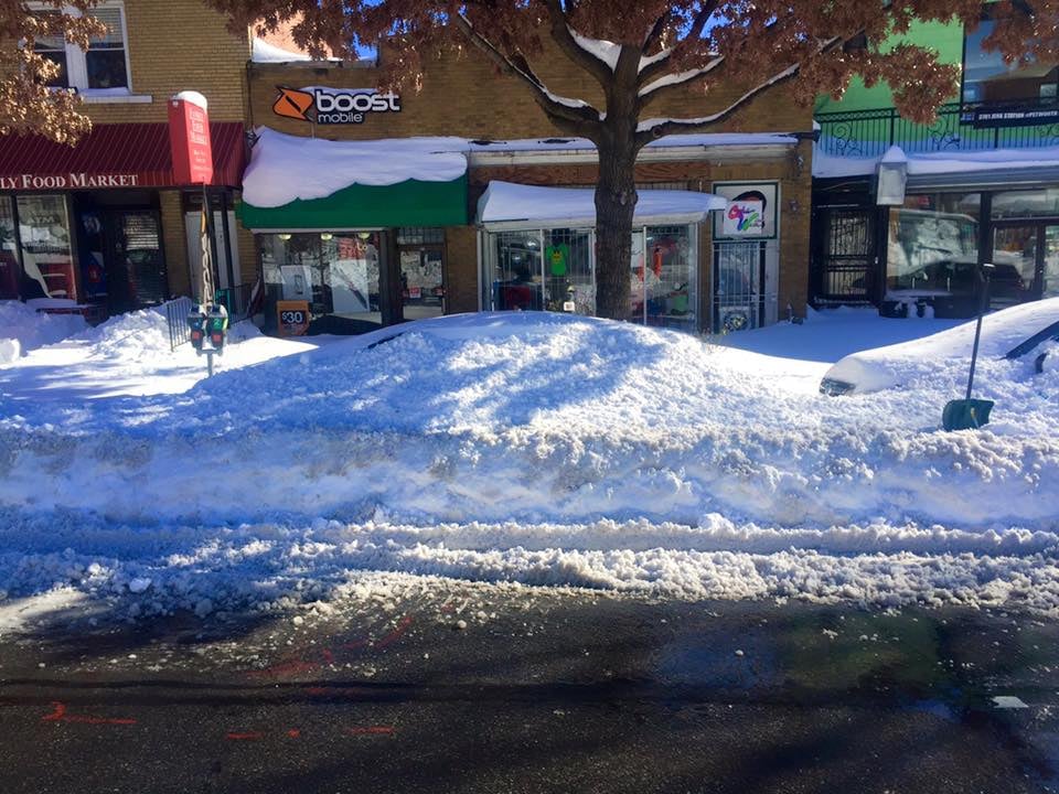 A picture I snapped in my neighborhood after the storm. There's a car buried under there!