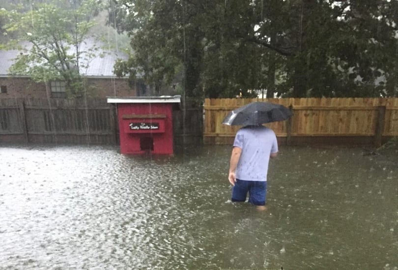 Lindsey’s husband checking on their chickens before evacuating.